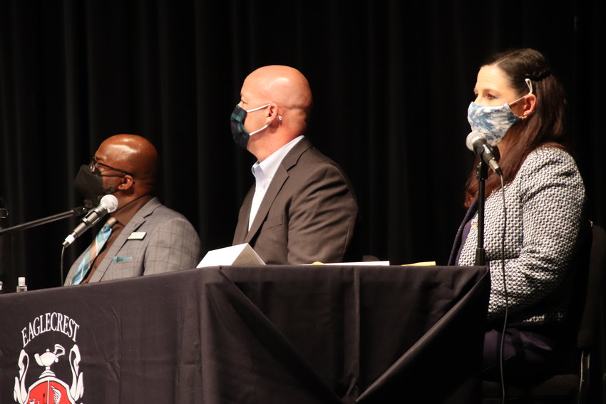 From left, candidates Jason Lester, Bill Leach and Kristin Allan sit on stage Sept. 21 at a Cherry Creek school board candidates' forum at Eaglecrest High School in the east Centennial area.